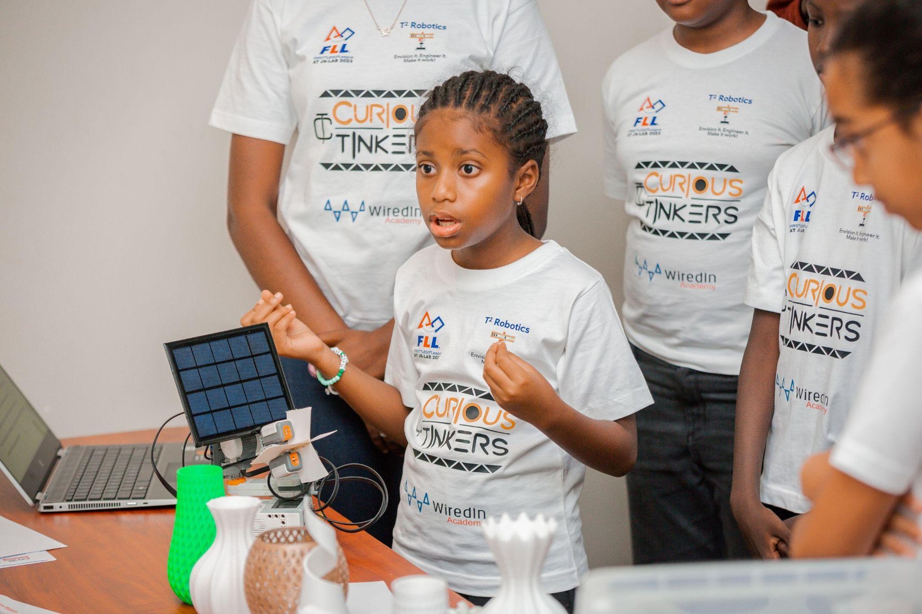 Jacky presenting a solar tracker at FIRST LEGO League